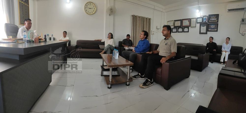 Minister Paiwang along with other officials during a review meeting in Mon of July 25. (DIPR Photo)